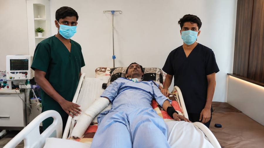 Echonova Care nursing staff attending to a patient at the bedside